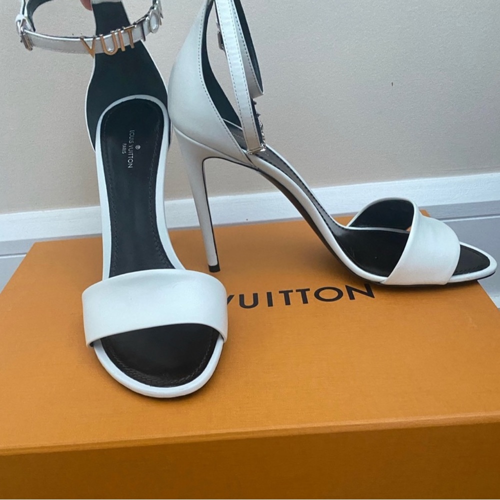 White Louis Vuitton callback sandals